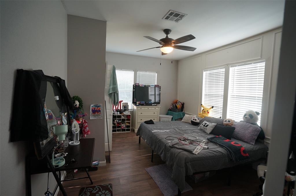 2115 Reuter Avenue Waco, TX 76708 - Photo 7 of 11 a living room with furniture a flat screen tv and a window