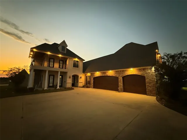 a front view of building with yard