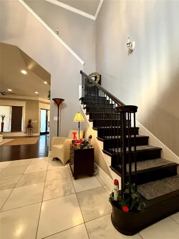 a living room with hard wood flooring and a fireplace