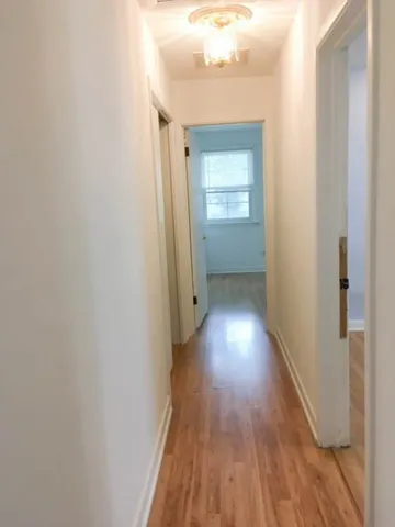 a view of gallery with wooden floor