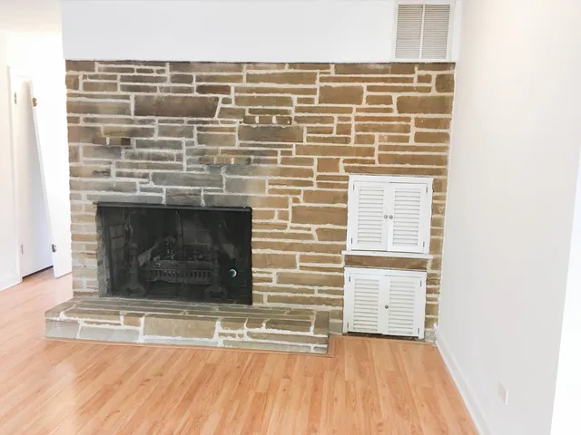 a view of fireplace and wooden floor