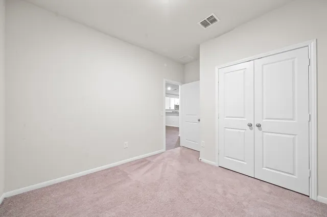 a view of a closet and utility room in a room