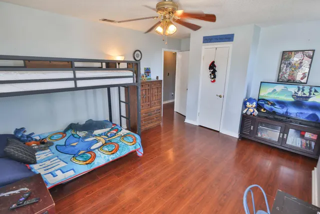 a room with furniture and wooden floor