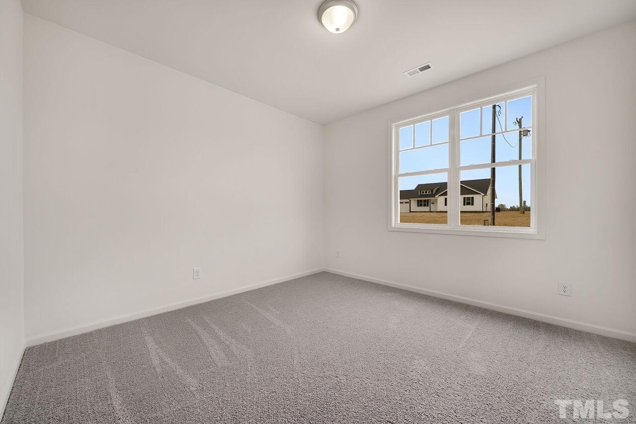 4066 Needham Road Bailey, NC 27807 - Photo 17 of 25 an empty room with windows