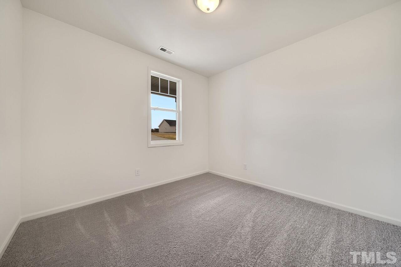 4066 Needham Road Bailey, NC 27807 - Photo 18 of 25 an empty room with a window