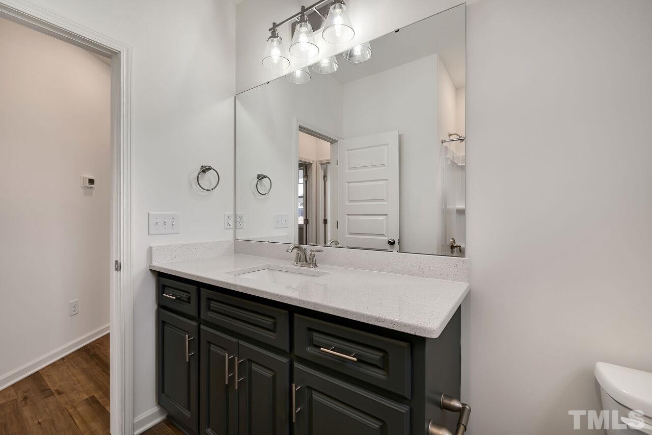 4066 Needham Road Bailey, NC 27807 - Photo 20 of 25 a bathroom with a sink and a mirror