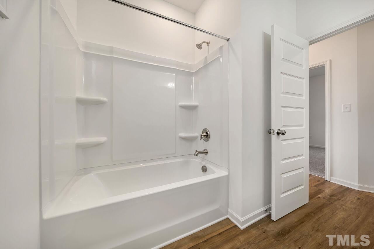 4066 Needham Road Bailey, NC 27807 - Photo 21 of 25 a bathroom with a bathtub and a shower