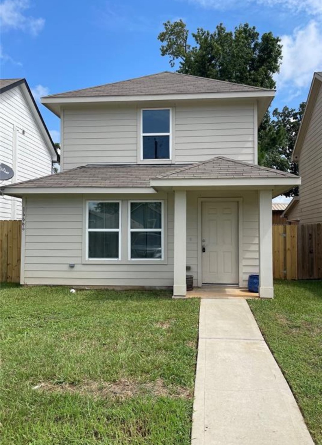 front view of a house with a yard