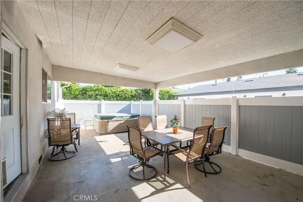 a living room with furniture a window and a table