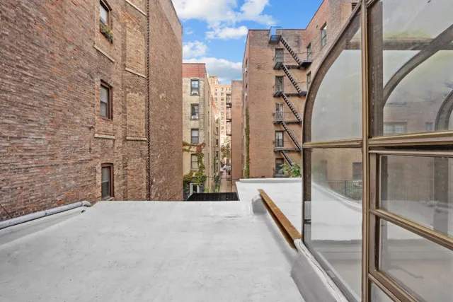 a view of balcony with wooden floor and stairs