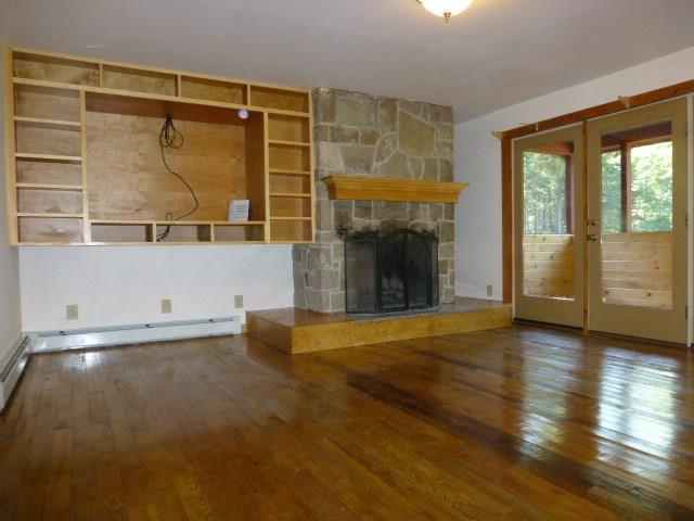 565 Toddy Pond Road Surry, ME 04684 - Photo 6 of 27 Lovely living room offers wood...