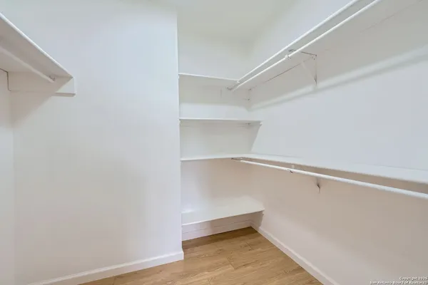 a view of an empty walk in closet