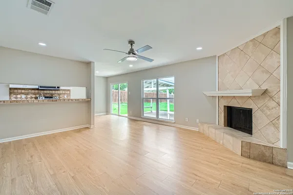 a view of a kitchen with a microwave and a floor to ceiling window