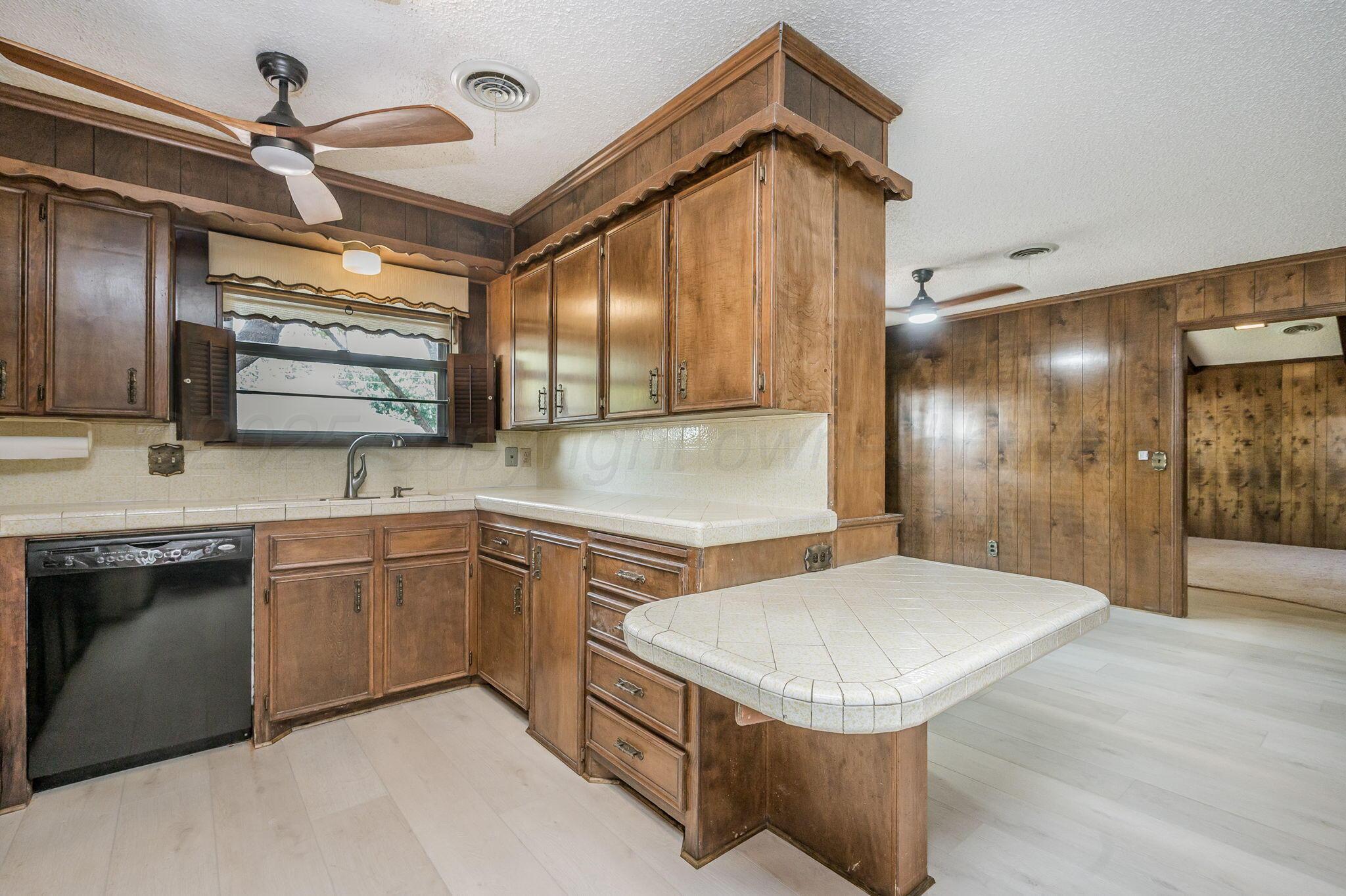 7830 Canode Drive Amarillo, TX 79121 - Photo 11 of 29 a bathroom with a sink a toilet and mirror
