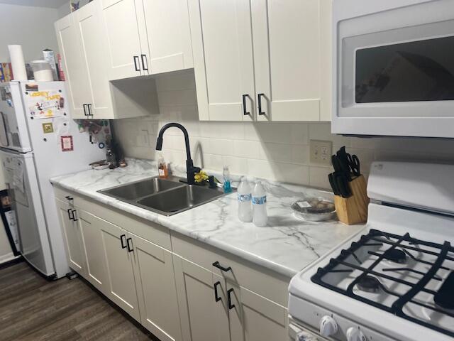 730-1 Juniper Road Valparaiso, IN 46385 - Photo 2 of 9 a kitchen with sink a stove and cabinets
