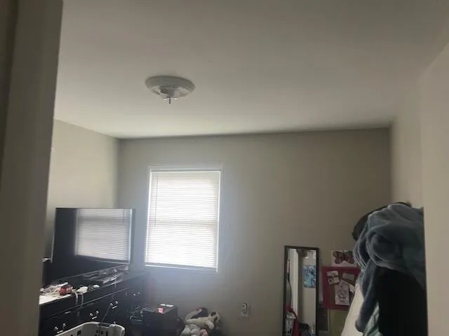 a room with furniture and a window