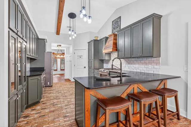 a bathroom with a toilet sink and shower