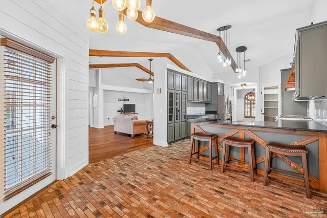 a view of a bathroom with a sink and a mirror