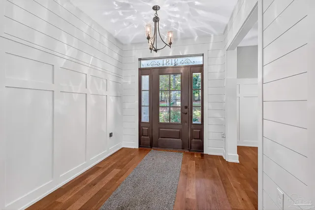 a view of an entryway with a door