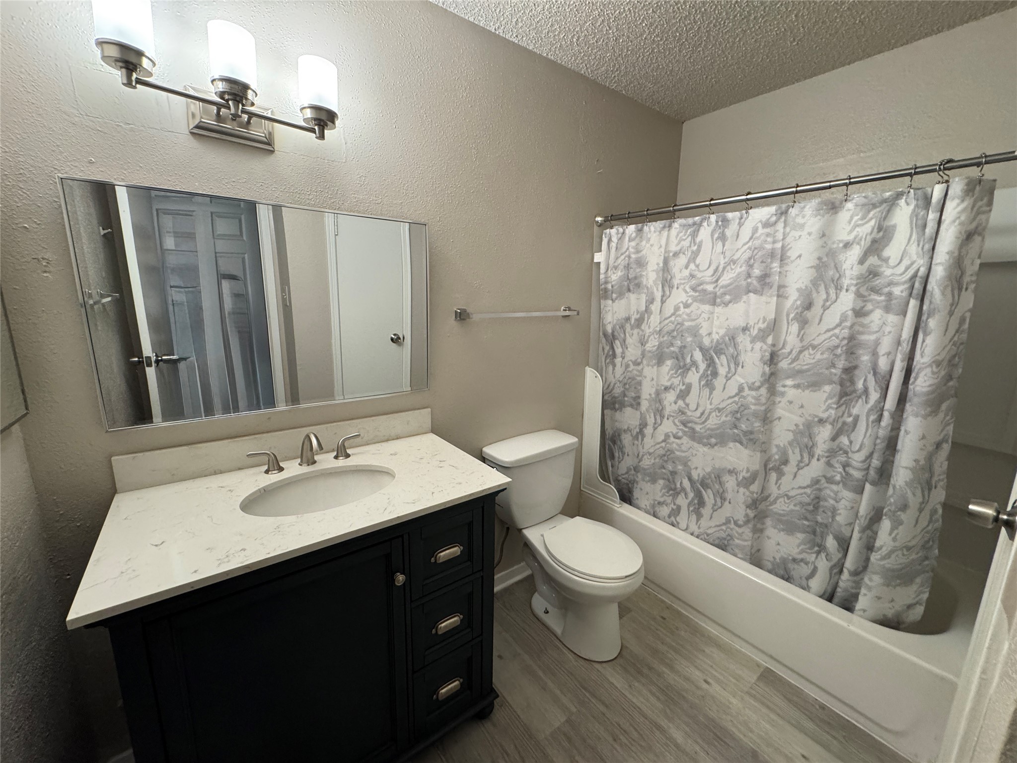 10101 South Gessner Road, Unit 305 Houston, TX 77071 - Photo 12 of 18 a bathroom with a sink and a mirror