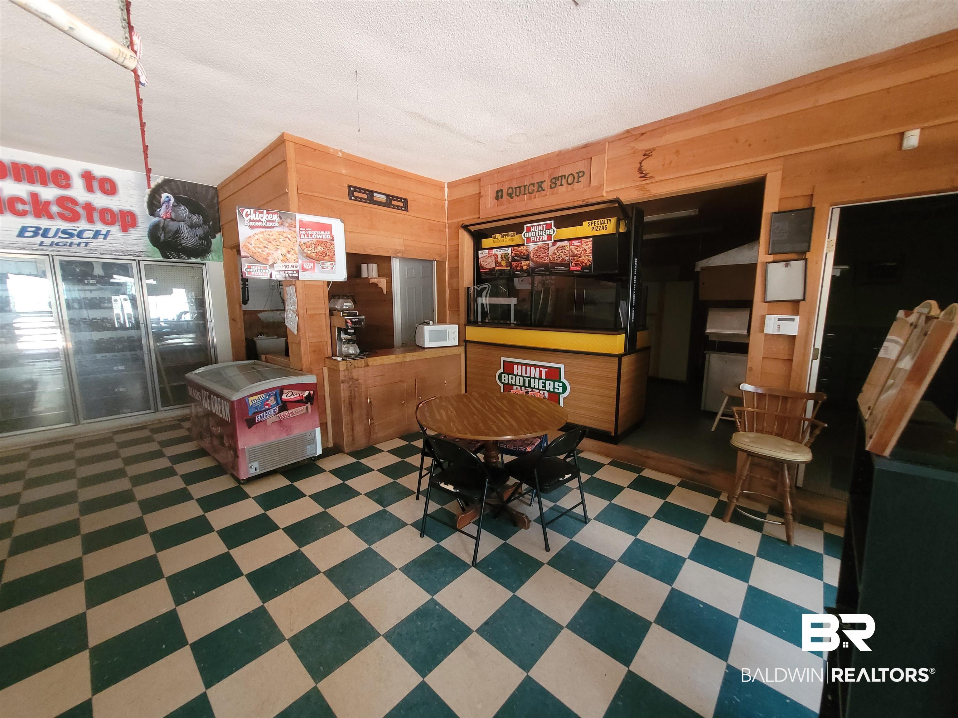 2777 Highway 83 Evergreen, AL 36401 - Photo 11 of 14 Miscellaneous room with a textured ceiling and wooden walls