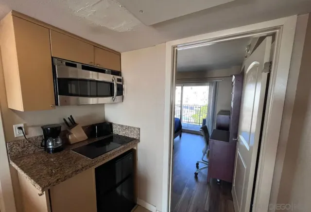 a kitchen with a sink and cabinets