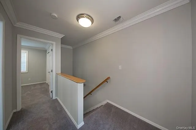 a view of a hallway with closet