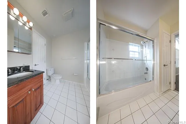 a bathroom with a granite countertop sink mirror and shower
