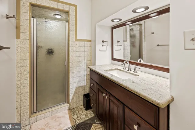 a spacious bathroom with a double vanity sink mirror and toilet
