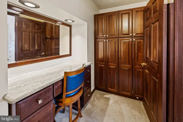 a bedroom with bed and wall painting