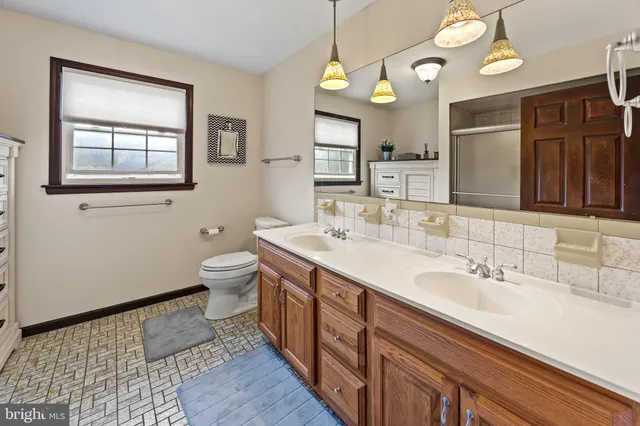 a bedroom with a bed and flat screen tv