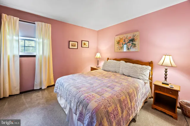 a bed room with a bed and a dresser