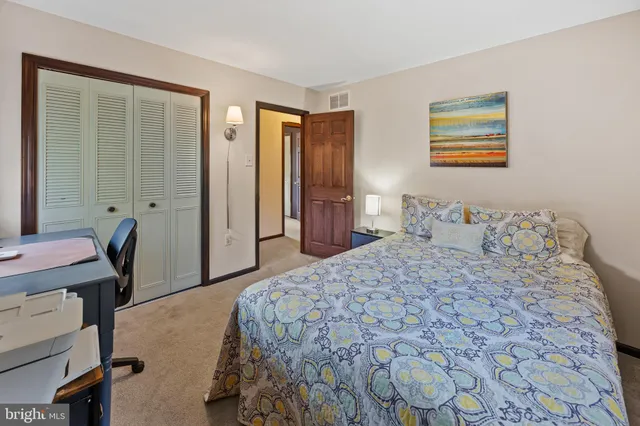 a view of a livingroom with furniture wooden floor and a rug