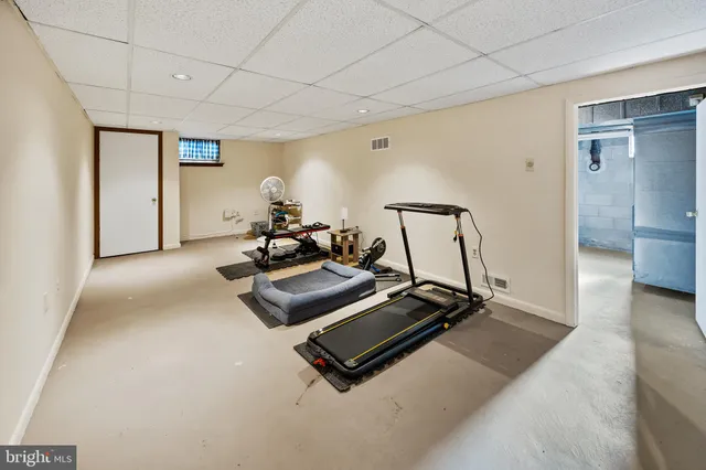 a view of a chair and table in the balcony
