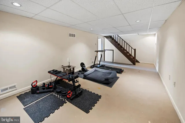 a balcony view with couple of chairs and wooden floor