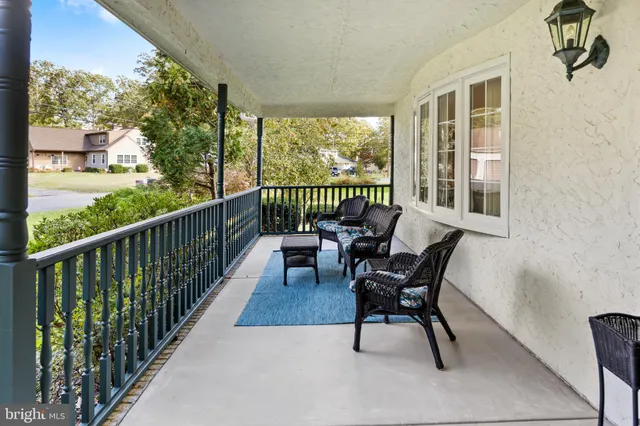 a view of a house with swimming pool and a yard