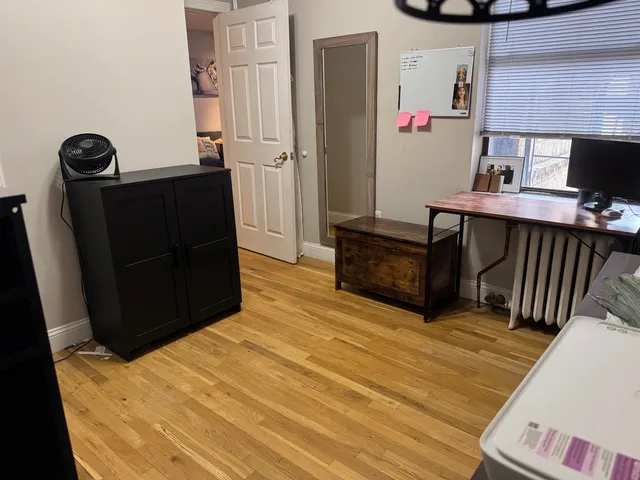 a bedroom with a bed and dresser