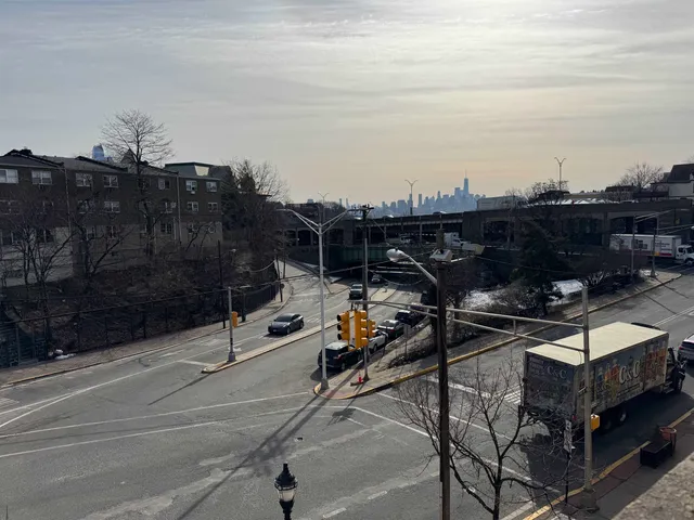a view of a patio with a table and chairs and potted plants