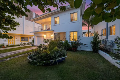 a view of a house with a yard porch and sitting area