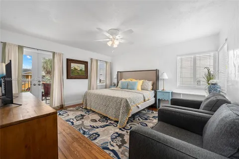 a bedroom with a bed and a couch