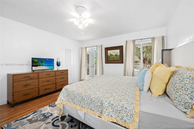 a bed room with a bed and a dresser