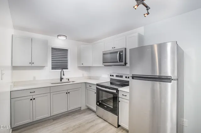 a bathroom with a shower and a toilet