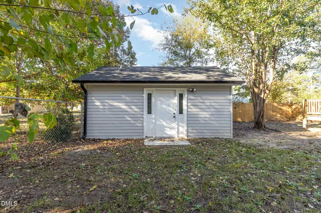 a house view with a garden space