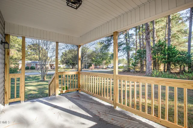 a view of house with outdoor space and tree s