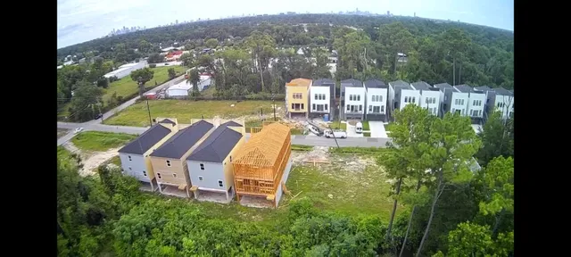 a view of a lake with a garden and mountain view