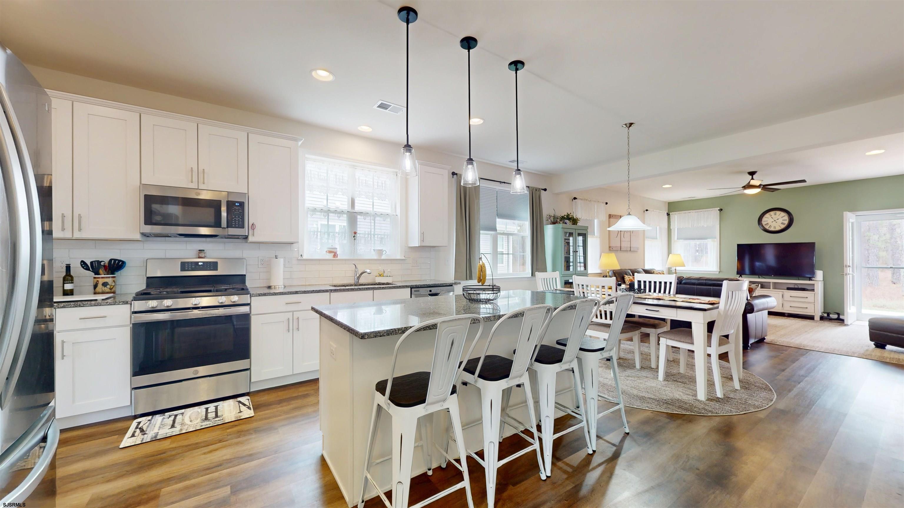 185 Keller Way Mays Landing, NJ 08330 - Photo 14 of 56 a large kitchen with a table and chairs