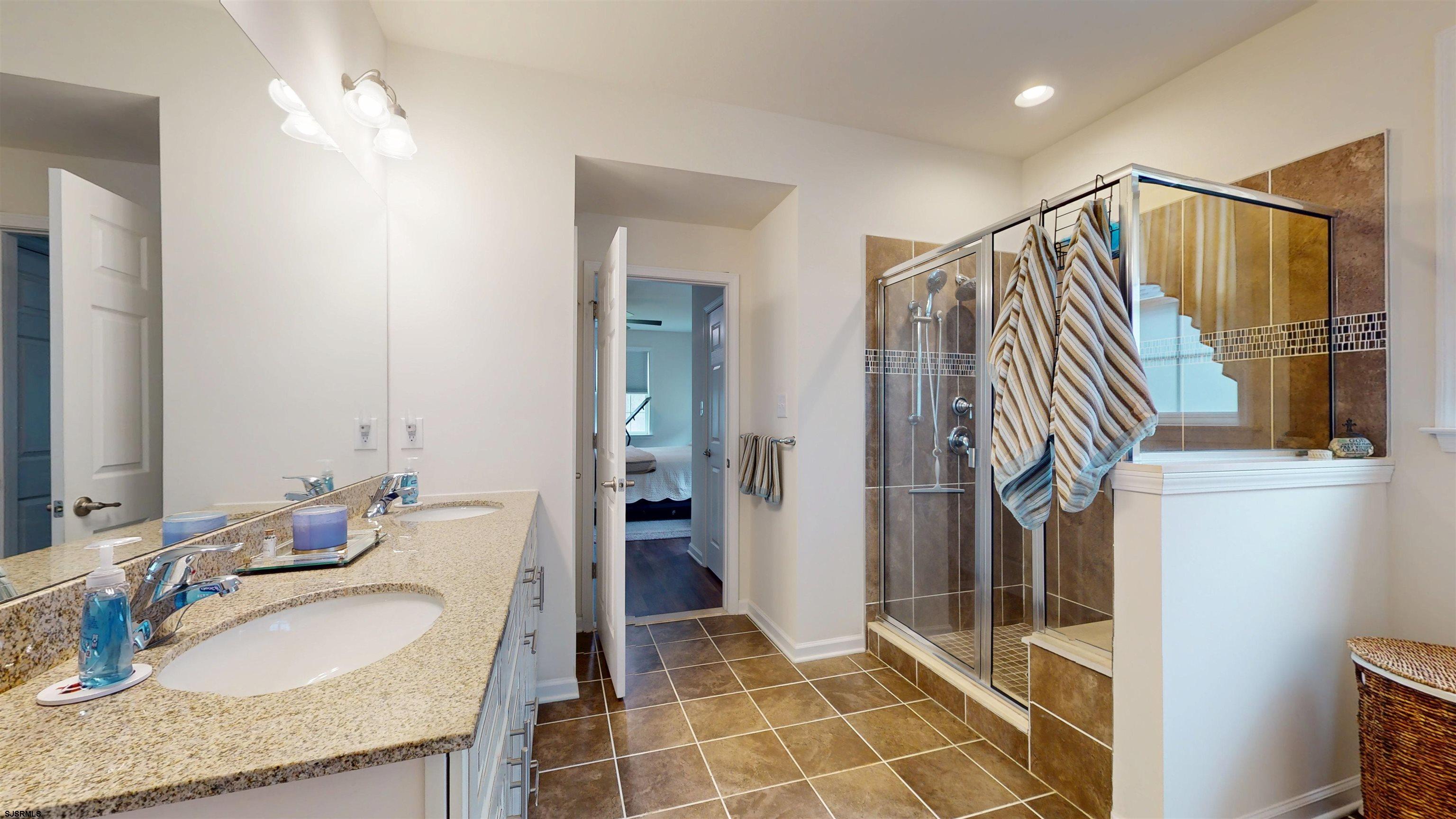 185 Keller Way Mays Landing, NJ 08330 - Photo 31 of 56 a bathroom with a granite countertop sink a mirror and shower