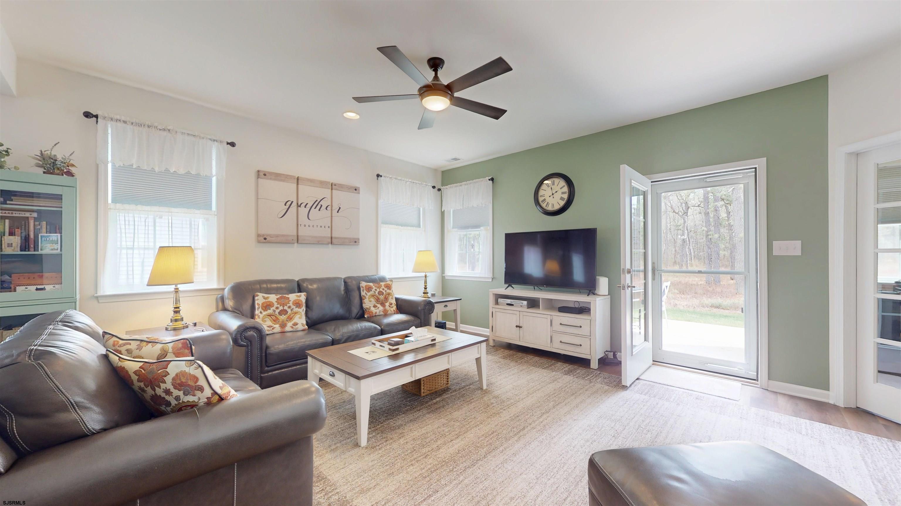 185 Keller Way Mays Landing, NJ 08330 - Photo 9 of 56 a living room with furniture a window and a flat screen tv