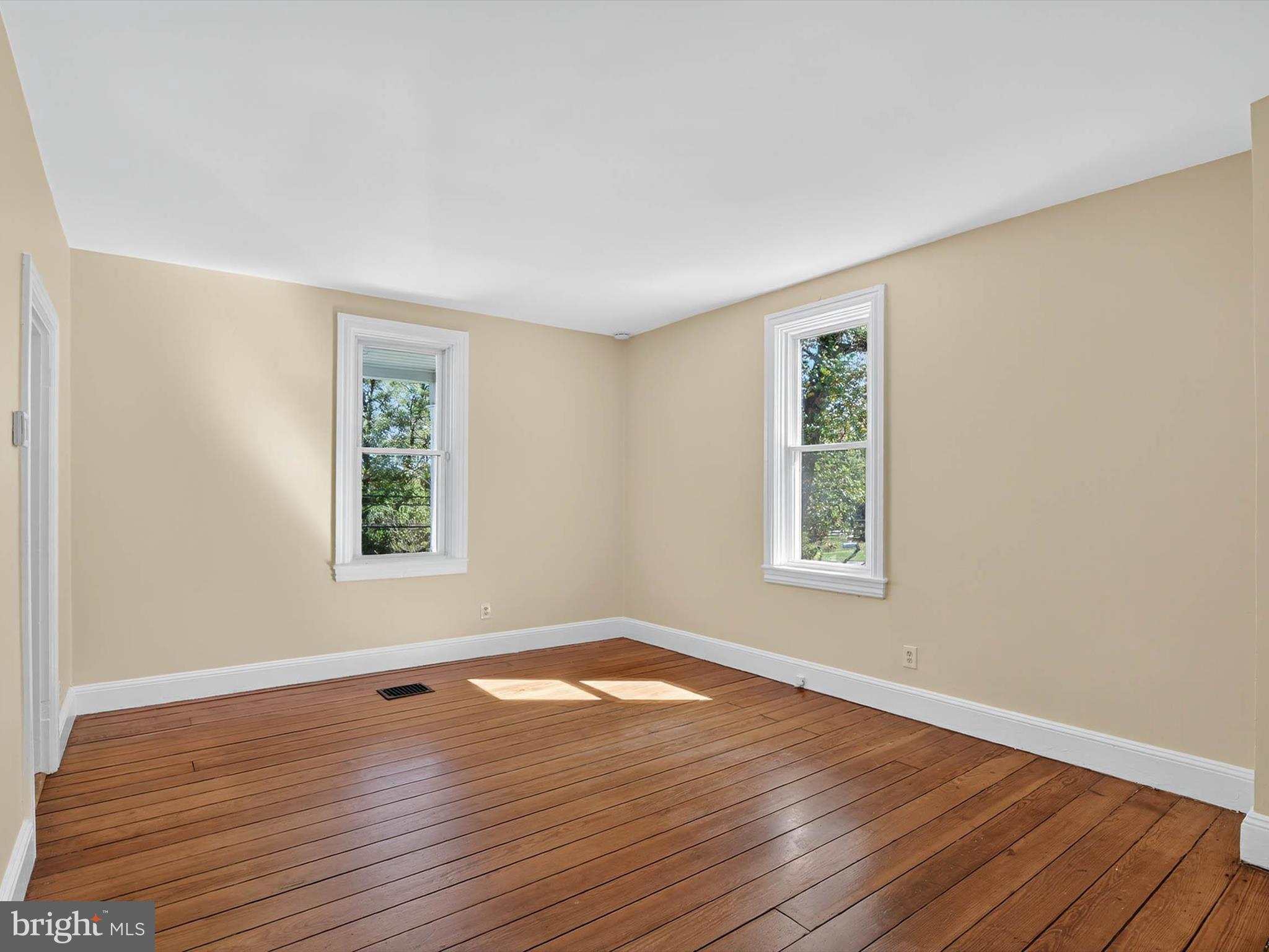 5334 Strasburg Road Kinzers, PA 17535 - Photo 15 of 44 a view of an empty room with wooden floor and a window