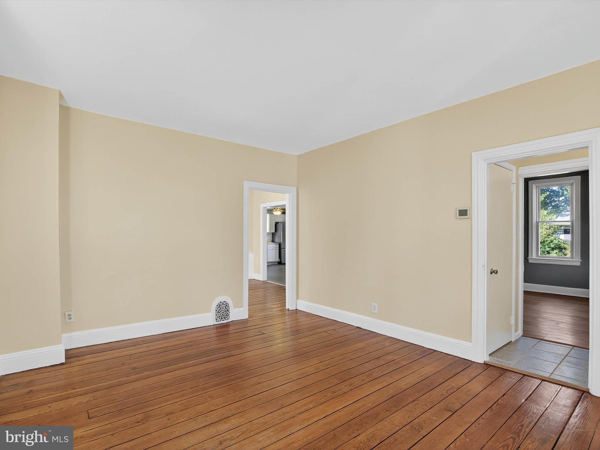 5334 Strasburg Road Kinzers, PA 17535 - Photo 16 of 44 a view of an empty room with wooden floor and a window